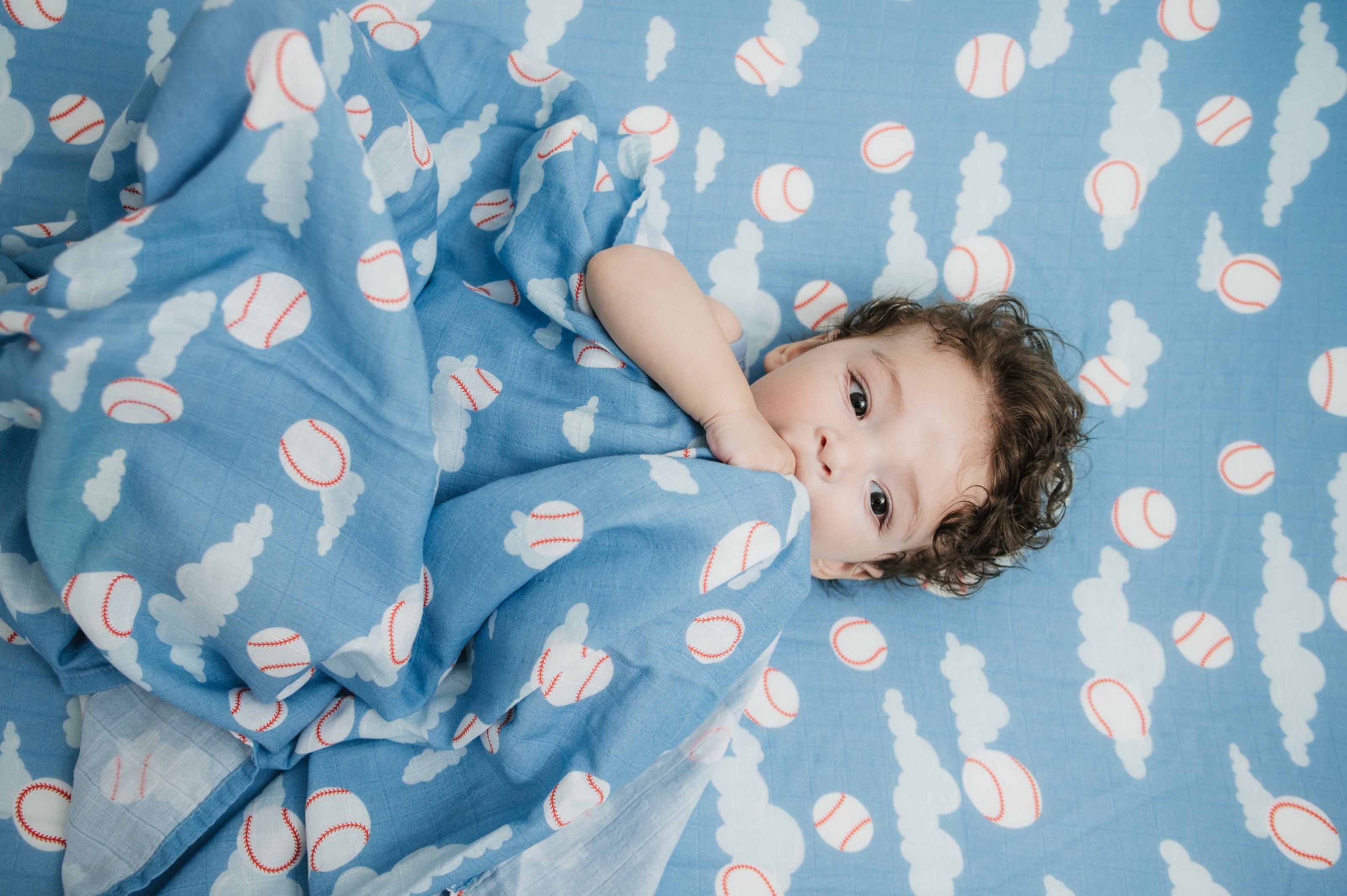 Organic Bamboo Cotton Muslin Crib Sheet in Baseballs in the Sky